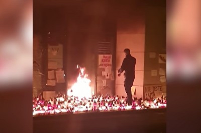 Policjant „gasi” pożar pod siedzibą PiS w Białymstoku 