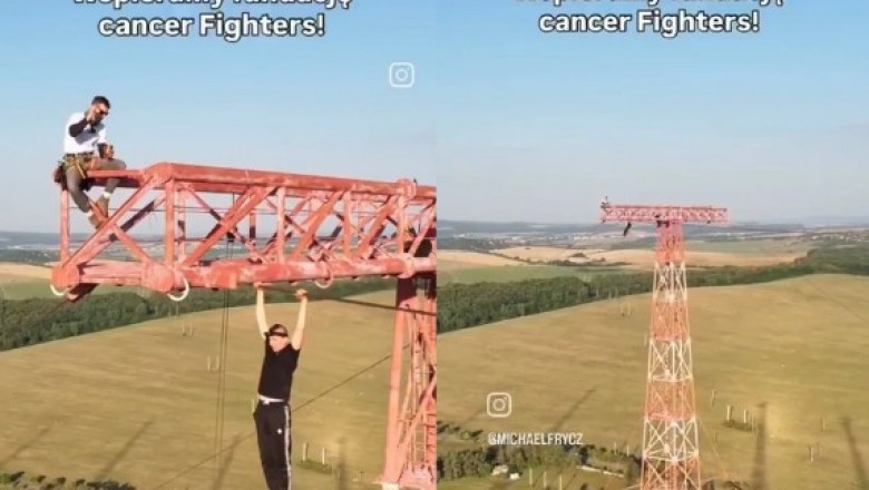 Ten sam gość, który wspiął się po balkonach do Łatwoganga, teraz zwisa z masztu wysokiego napięcia.